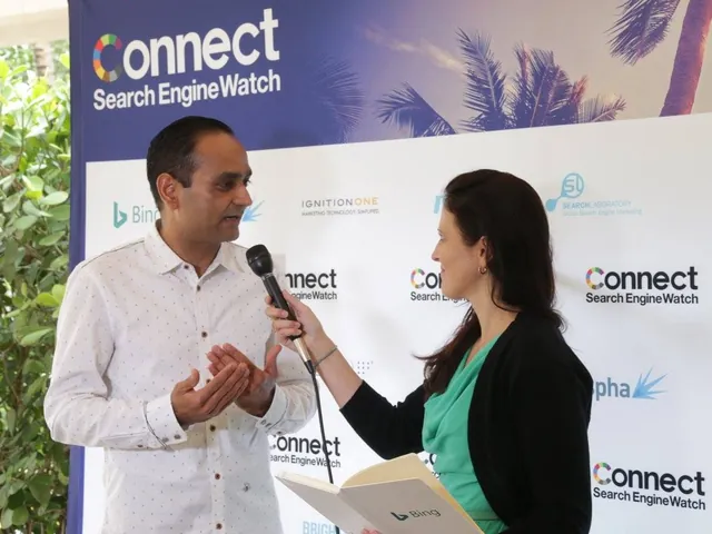 Two speakers on stage in front of the Connect banner