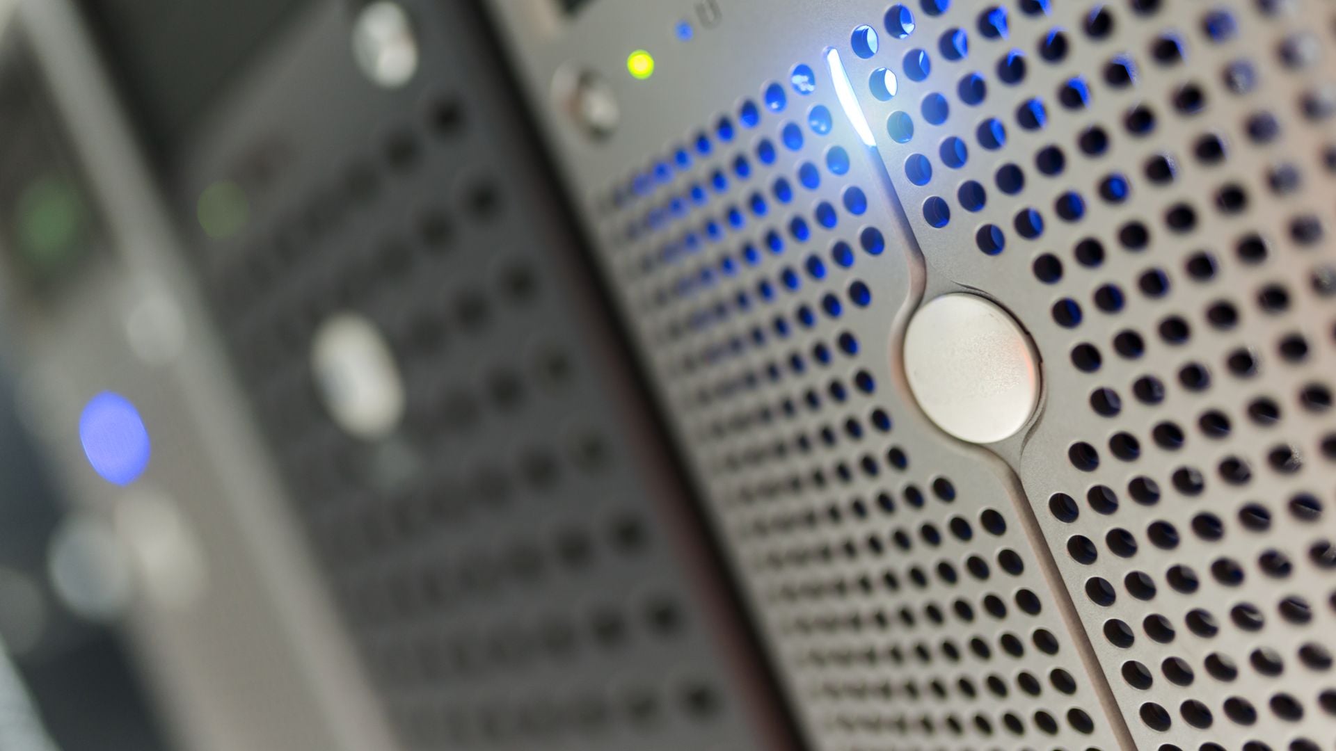 Close-up of computing hardware with blue indicator lights