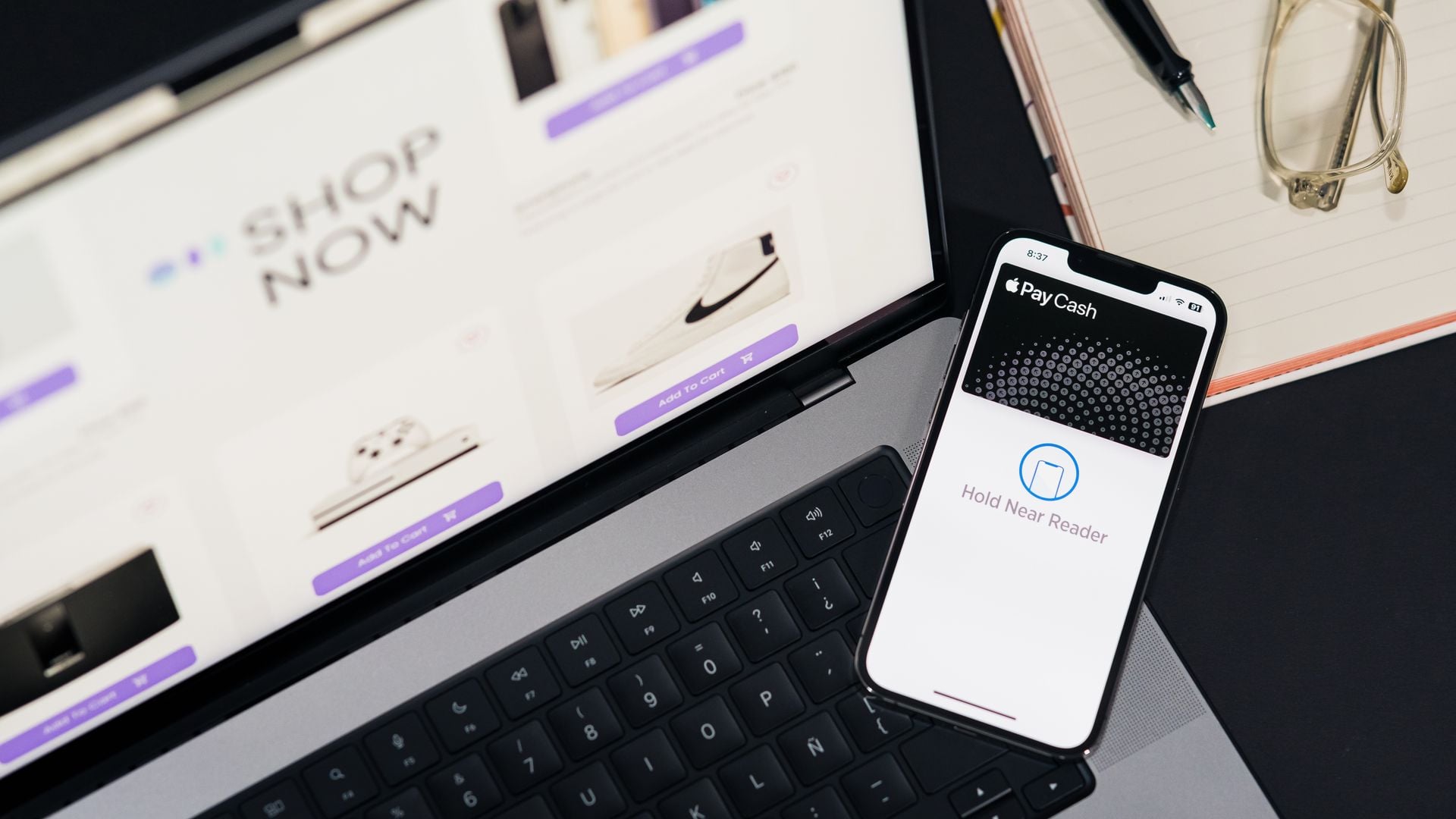Laptop showing an online store beside a phone with a digital wallet open