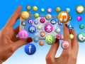 A picture of a pair of hands holding a mobile device horizontally. A cloud of bubbles featuring icons for music and TV and social media logos is floating out of the screen.
