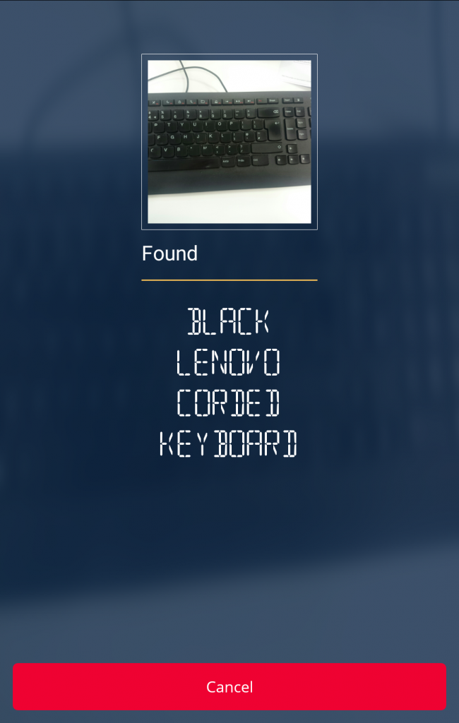 A mobile screenshot showing a successful CamFind object search. At the top is an image of a black keyboard. Below it is the word 'found'. Then reading downwards in a column are the words 'Black Lenovo corded keyboard'.