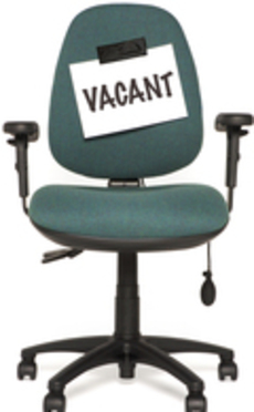 A chair with a vacant notice taped to it