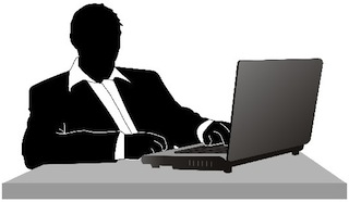 guy-in-suit-at-computer